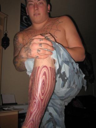 College Humer Tattoo On Leg